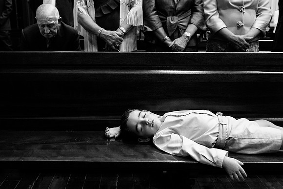 Ring bearer sleeping in the church
